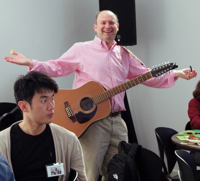 Jonathan Lazar pictured with hands stretched out and smiling