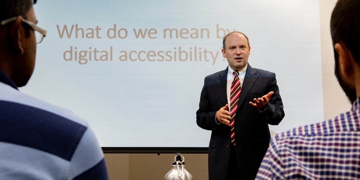 Dr. Jonathan Lazar, recipient of the ACM SIGACCESS Award for Outstanding Contributions to Computing and Accessibility, pictured lecturing on digital accessibility at the UMD iSchool