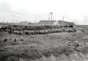 Workers from the Tule Lake farm eat lunch